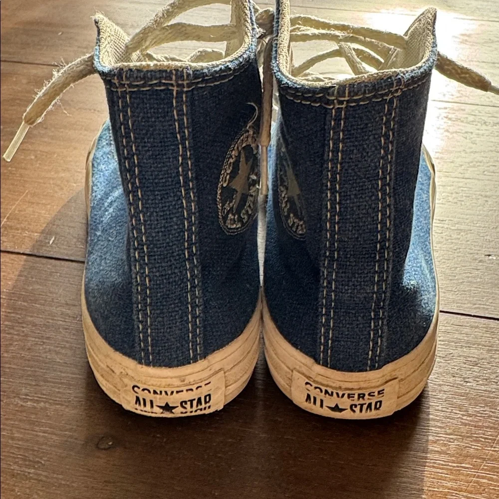 Size 2 Converse Chuck Taylor All Star Sneakers on blue